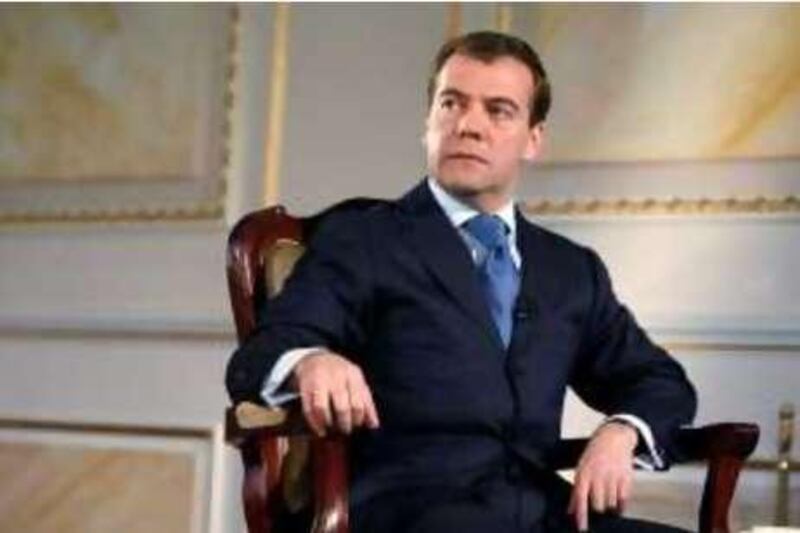 Russian President Dmitry Medvedev listens in Moscow's Kremlin during an interview broadcast by Russian television on Wednesday, June 25, 2008. (AP Photo/ RIA Novosti, Dmitry Astakhov, Presidential Press Service)