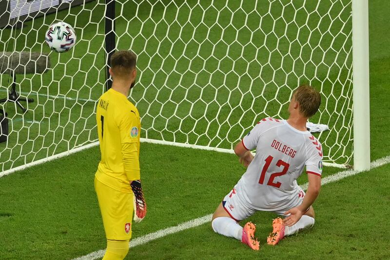 Denmark's Kasper Dolberg, right, scores his side's second goal.