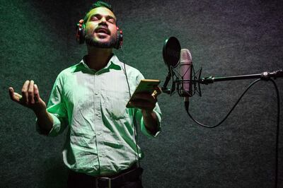 Singer Mohammed Aslam, 31, records a Kathu Pattu song at a musical studio located in Mampuram, Kerala, India. Photo by Sebastian Castelier