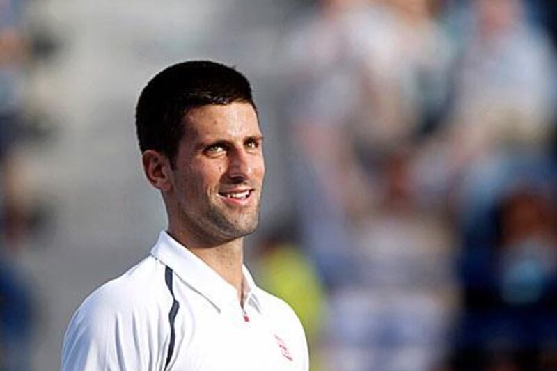 Novak Djokovic is all smiles after enjoying his time on the surface in Abu Dhabi, beating David Ferrer.