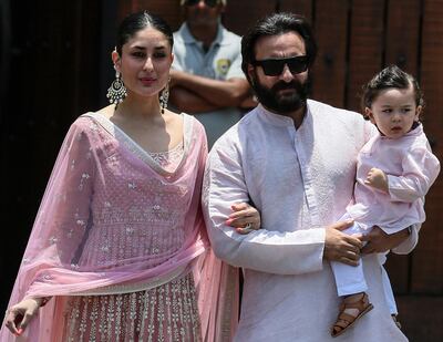 epa06719456 Bollywood actors and couple Kareena Kapoor Khan (L) and Saif Ali Khan with their son Taimur arrive at the wedding ceremony of his sister and Bollywood actress Sonam Kapoor in Mumbai, India, 08 May 2018. The 32-year-old actress got married to Indian  businessman Anand Ahuja in a sikh wedding at her aunt's mansion Rockdale.  EPA/DIVYAKANT SOLANKI