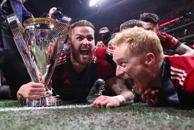 Atlanta United's players celebrate with the MLS Cup. Reuters