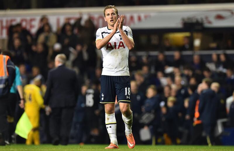 Tottenham Hotspur’s English striker Harry Kane applauds their supporters at the final whistle in the English Premier League football match between Tottenham Hotspur and Everton at White Hart Lane in north London on November 30, 2014. Tottenham won the game 2-1. AFP PHOTO / BEN STANSALL