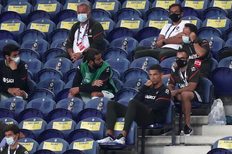 Portugal's Cristiano Ronaldo, foreground right, watches from the stands. AP Photo