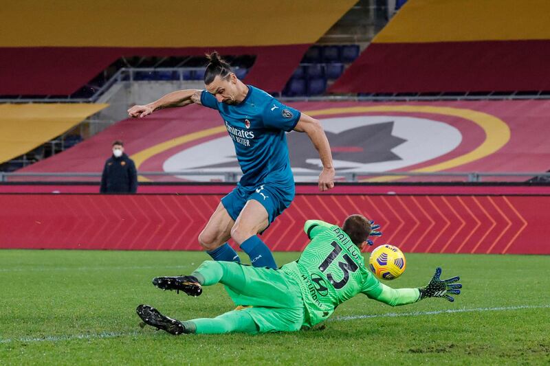 AC Milan's Zlatan Ibrahimovic and Roma's goalkeeper Pau Lopez in action. EPA