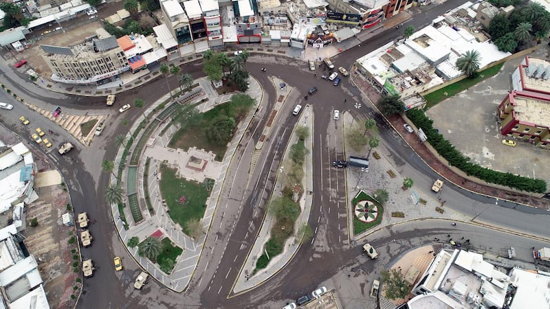 An aerial picture shows empty streets during precautionary measures against the novel coronavirus outbreak in central Baghdad. EPA