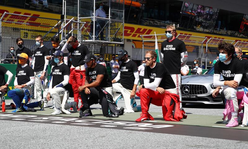 Formula One drivers including Lewis Hamilton, centre, and Sebastian Vettel, right, take a knee in support of the Black Lives Matter movement ahead of the Austrian Grand Prix at the Red Bull Ring.