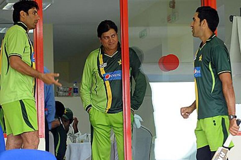 Sharjah, United Arab Emirates- November 07,  2011:  Pakistan's cricket captain Misbah-ul-Haq (L) speaks with coach Mohsin Khan (C) and Umar Gul (R) in the pavilion during the rain delay on the final day of the third and final Test match between Pakistan and Sri Lanka at  Cricket Stadium  in Sharjah. (  Satish Kumar / The National ) For Sports