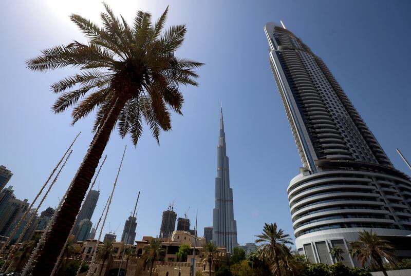 Dubai, United Arab Emirates - Reporter: N/A. Standalone. Stock. General view of Downtown with a plan tree the Burj Khalifa and the Address hotel. Saturday, September 5th, 2020. Dubai. Chris Whiteoak / The National