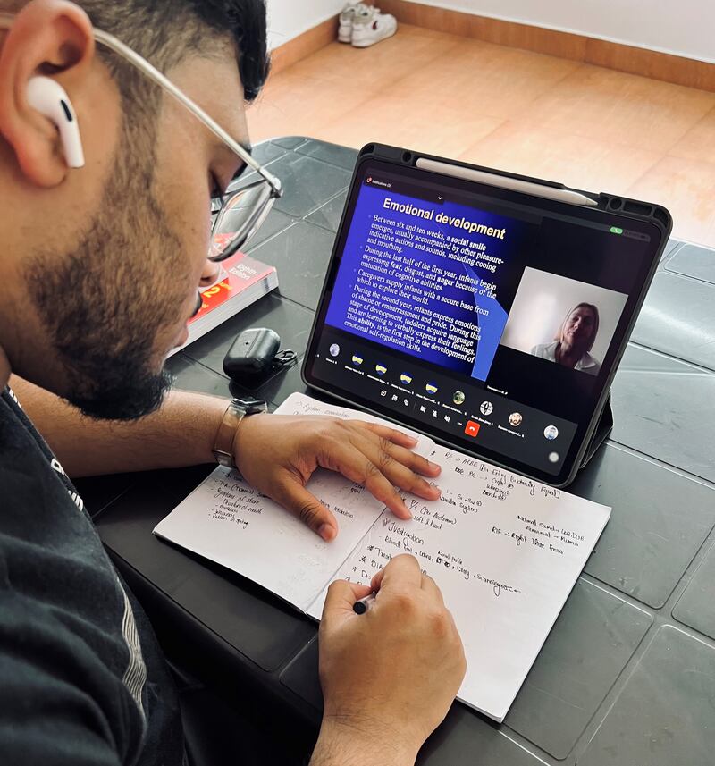 UAE resident Adil Javad makes notes as he listens in to a class. Photo: Adil Javad 
