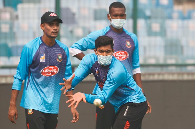 Bangladesh's Soumya Sarkar, wearing a face mask, catches a ball during a practice session at Arun Jaitley Cricket Stadium in New Delhi. AFP