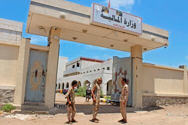 Fighters with Yemen's separatist Southern Transitional Council (STC) stand guard at the entrance of the Ministry of Finance's premises in the southern city of Aden, on April 26, 2020. AFP