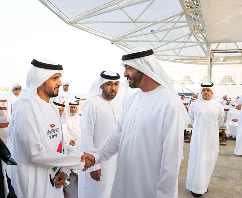 ABU DHABI, UNITED ARAB EMIRATES - December 16, 2019: HH Sheikh Mohamed bin Zayed Al Nahyan, Crown Prince of Abu Dhabi and Deputy Supreme Commander of the UAE Armed Forces (R) greets a member of 'Journey of the Union' initiative, during a Sea Palace barza.

( Mohamed Al Hammadi / Ministry of Presidential Affairs )
---