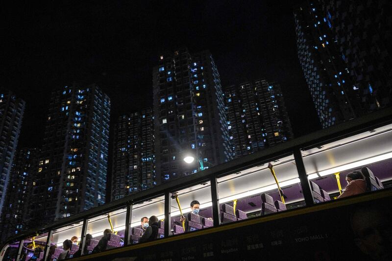 Passengers on board a bus shortly before their departure from Tuen Mun in Hong Kong to Shenzhen, via the Shenzhen Bay Bridge.  AFP