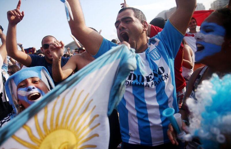 Argentina fans celebrate after Lionel Messi's winner against Iran on Saturday at the 2014 World Cup. Mario Tama / Getty Images / June 21, 2014