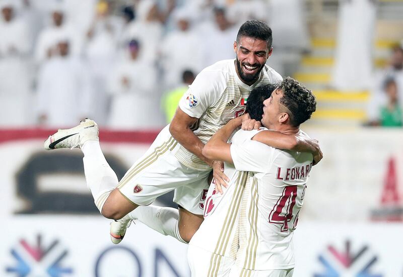 Abu Dhabi, United Arab Emirates - August 12, 2019: Mohammed Al Menhali (M) of Al Wahda scores during the Asian Champions League round 16 return leg between Al Wahda of the UAE and Al Nassr of Saudi Arabia. Monday the 12th of August 2019. Al Wadha, Abu Dhabi. Chris Whiteoak / The National