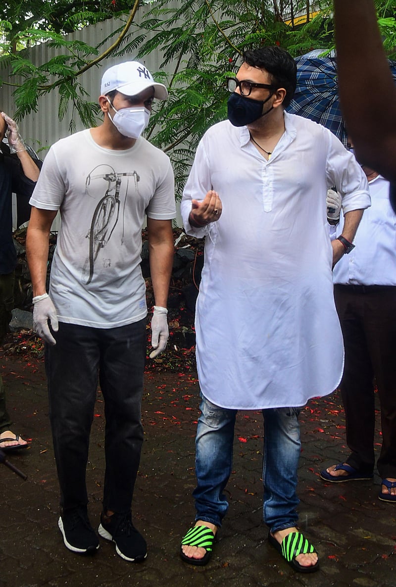 Bollywood actor Rajkummar Rao, left, and producer-director Dinesh Vijan attend the funeral of Bollywood actor Sushant Singh Rajput, in Mumbai on June 15, 2020. AFP