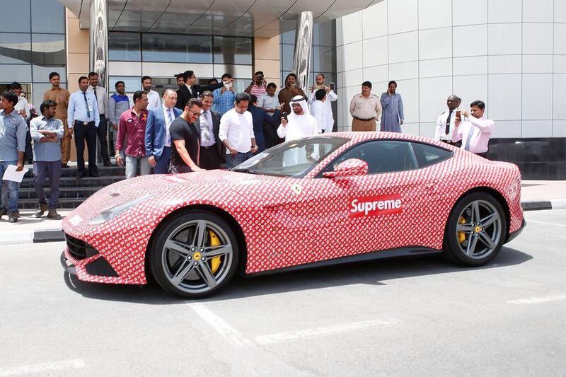 Bollywood actor Salman Khan admires Rashed Belhasa's flamboyant Ferrari. Courtesy Foilx