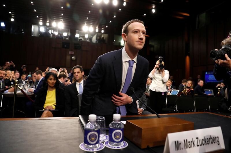 FILE PHOTO: Facebook CEO Mark Zuckerberg arrives to testify before a Senate Judiciary and Commerce Committees joint hearing regarding the company’s use and protection of user data, on Capitol Hill in Washington, DC, U.S., April 10, 2018.  REUTERS/Aaron P. Bernstein/File Photo