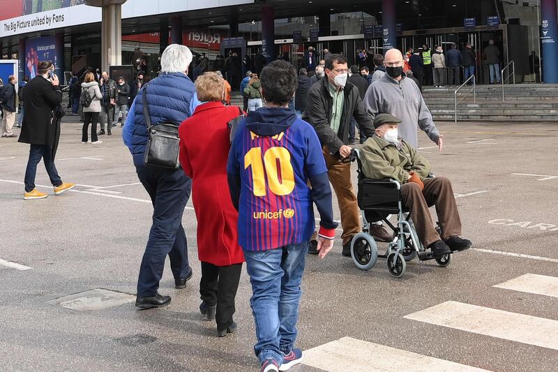 Barcelona club members arrive to cast their votes. AFP