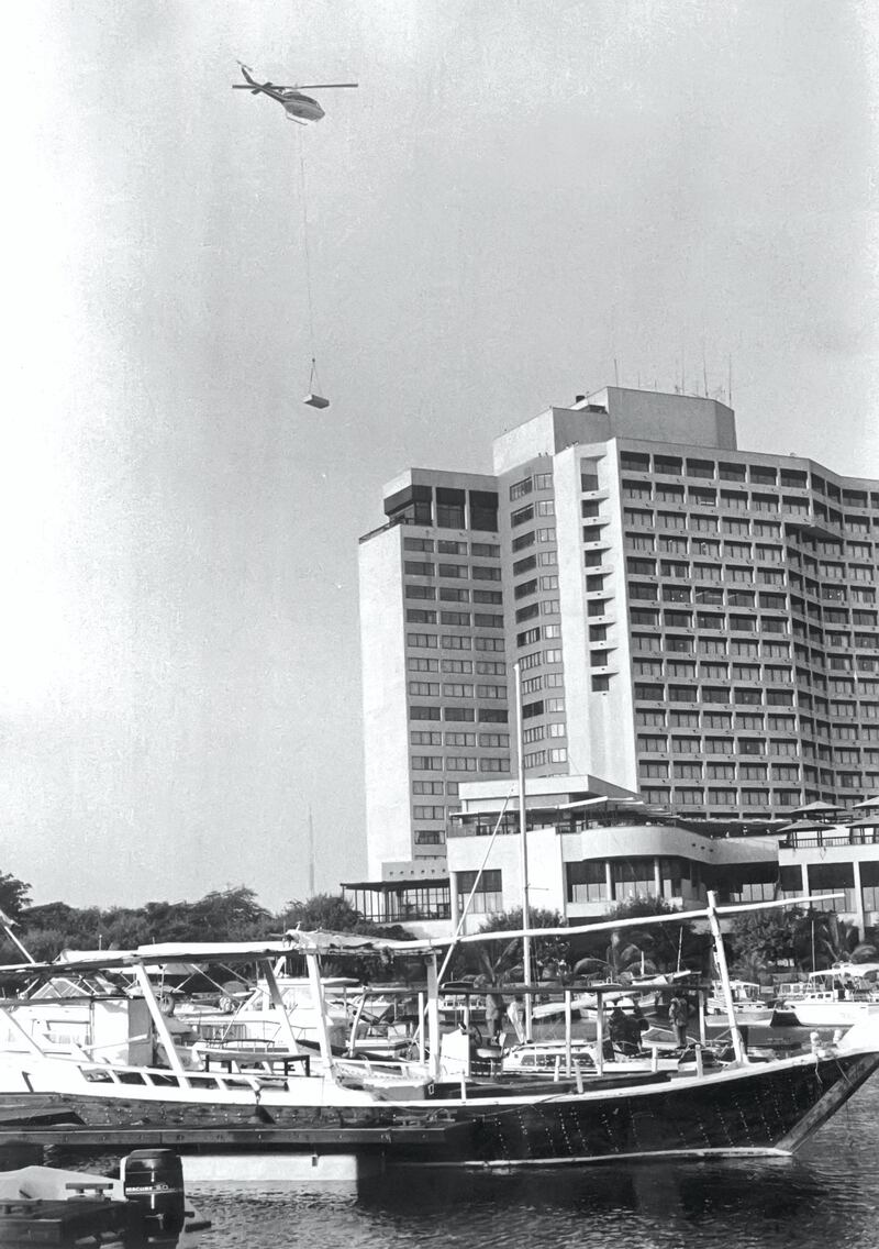 Abu Dhabi's InterContinental. In this photograph, a table for the 1981 GCC summit is being brought in to the hotel by helicopter. Courtesy: Intercontinental Hotel