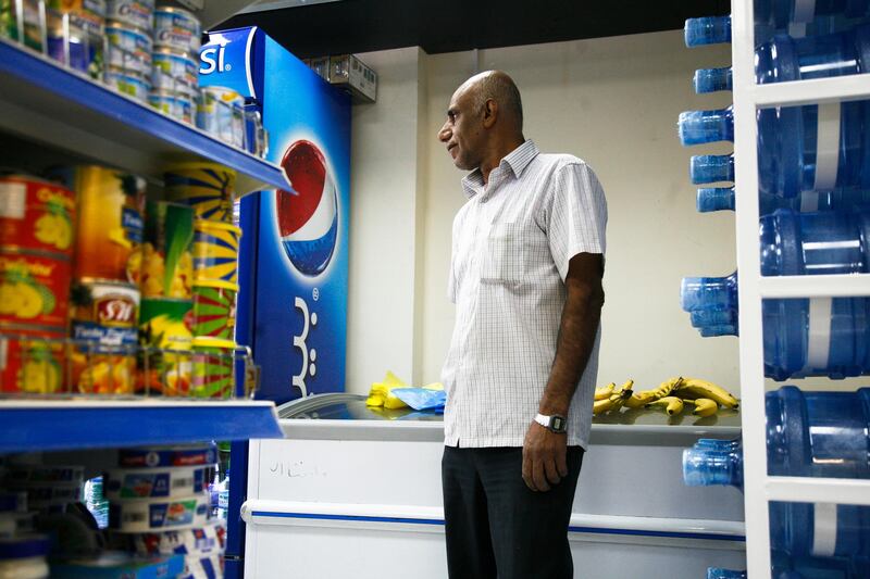 Abu Dhabi, UAE, December 31, 2012: 

2013 will force many of Abu Dhabi's small grocery stores to close. The government has imposed new regulations that many shopkeepers cannot adhere to. 

Seen here is Mehdi, an employee of the re-furbished Baqala grocery store. They've managed to get the shop up to speed and will not have any issues in the new year.
Lee Hoagland/The National