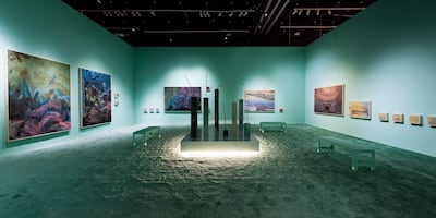 Hashel Al Lamki's blue-green installation 'Neptune', of soft, abstract paintings, refers to the continued plunder of the earth's resources. Photo: Abu Dhabi Art