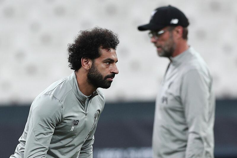Salah and Liverpool's head coach Juergen Klopp during a training session. EPA