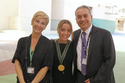 Elif and her family celebrate after receiving the Haitham Zamzam Al Hammadi Medal of International Friendship. American Community School of Abu Dhabi, May 2018