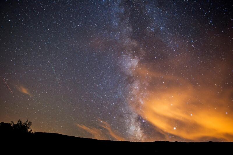 epaselect epa06141758 Two meteorite of the swarm of meteorites Perseida burn up in the atmosphere next to the Milky Way early 13 August 2017, over San Miguel de Aguayo, Spain. The Perseid meteor shower occurs every year in summer when the Earth passes through debris and dust of the 109P/Swift-Tuttle comet. The Perseids, one of the brightest meteorite swarms, consist of a multitude of stellar particles which due to their high speed glow up and burn by entering Earth's atmosphere.  EPA/PEDRO PUENTE HOYOS