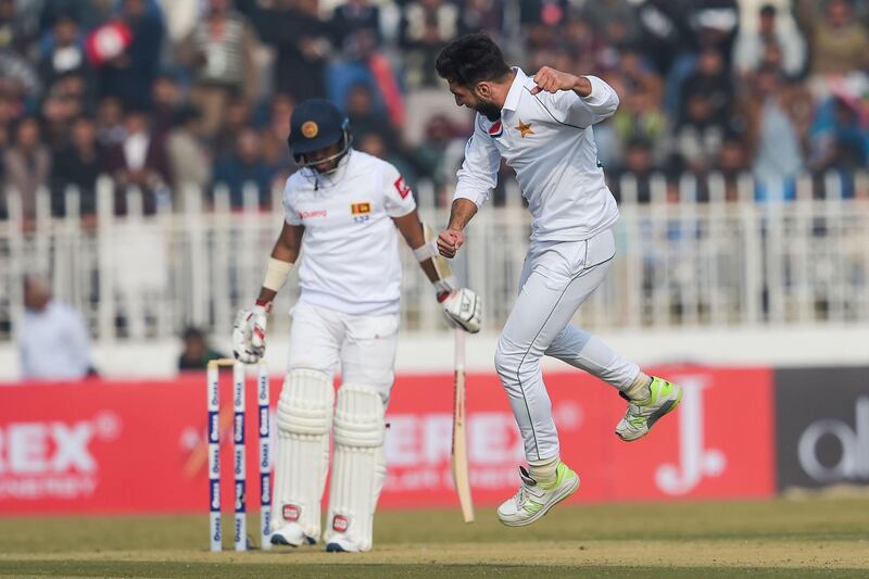 Pakistan's Usman Shinwari, right, celebrates after dismissing Kusal Mendis in Rawalpindi. AFP