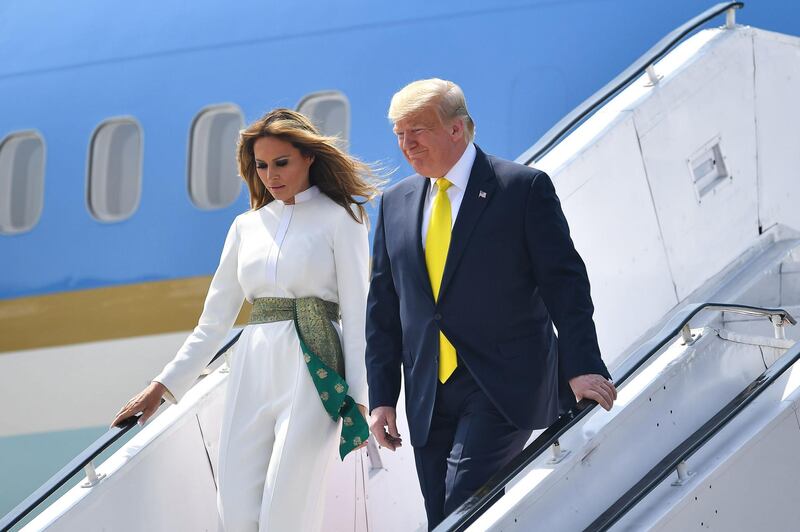 US President Donald Trump and First Lady Melania Trump disembark from Air Force One at Sardar Vallabhbhai Patel International Airport in Ahmedabad.  AFP