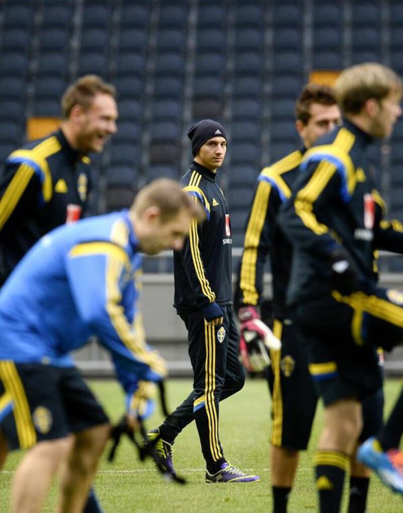 The spotlight will be on Zlatan Ibrahimovic, centre, as Sweden tries to make up a one-goal deficit and pip Portugal for a place at the 2014 World Cup. Jonathan Nackstrand / AFP