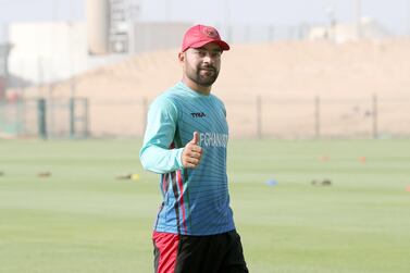 Rashid Khan, captain of the Afghanistan cricket team, is training with his teammates in Abu Dhabi ahead of their tour of Bangladesh in September. Pawan Singh / The National