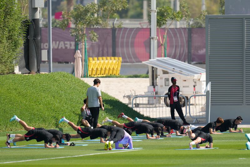 South Korea players warm up ahead of training. AP