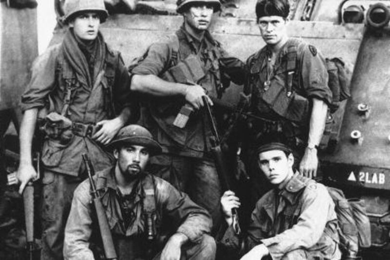 In this publicity image released by Metro Goldwyn Mayer/Orion Pictures, top row from left, Charlie Sheen, Tom Berenger, Willem Dafoe, from bottom left, Francesco Quinn and Kevin Dillon is shown in a scene from "Platoon." (AP Photo/Metro Goldwyn Mayer/Orion Pictures)