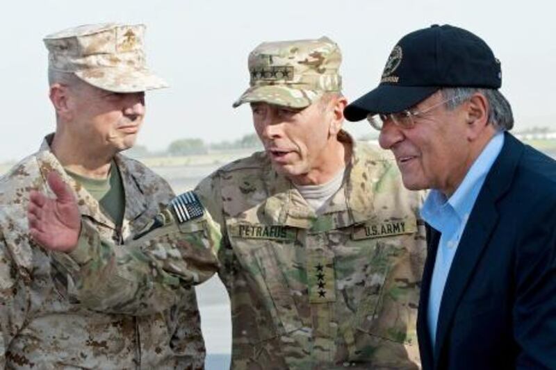 (FILES) In this photograph taken on July 9, 2011, US General John Allen (L) and General David Petraeus (C) greet US Secretary of Defence Leon Panetta (R) as he lands in Kabul.  The US commander in Afghanistan, General John Allen, is under investigation for "inappropriate" emails to a woman linked to the sex scandal involving former CIA director David Petraeus, a defense official said November 13, 2012. The revelation represented yet another stunning turn in a widening scandal that has jolted Washington only days after the re-election of President Barack Obama, with lawmakers vowing to get to the bottom of case.    AFP PHOTO/POOL/PAUL J. RICHARDS/FILES

 *** Local Caption ***  881135-01-08.jpg