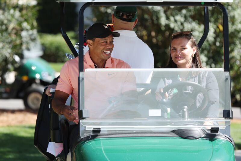 Tiger Woods makes his way to the practice area at Augusta National Golf Club. Getty