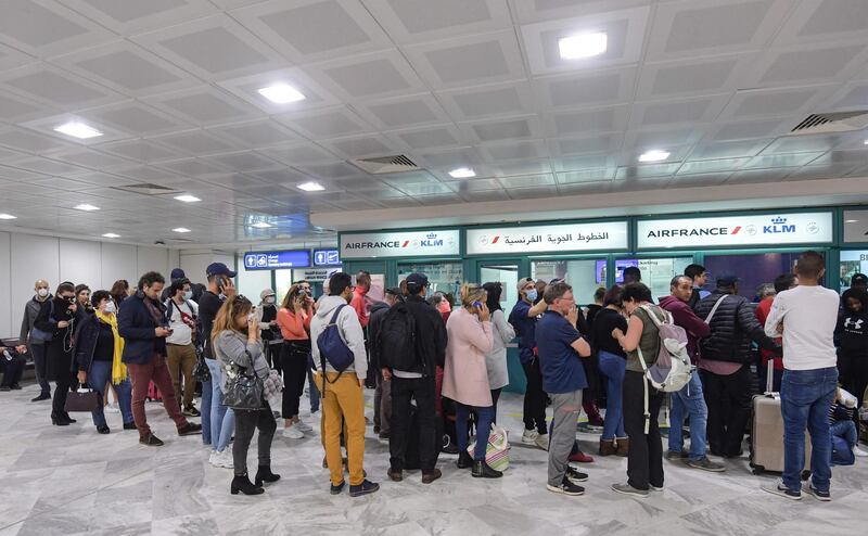 French tourists stranded at Tunis Carthage wait for flights to return to France. AFP