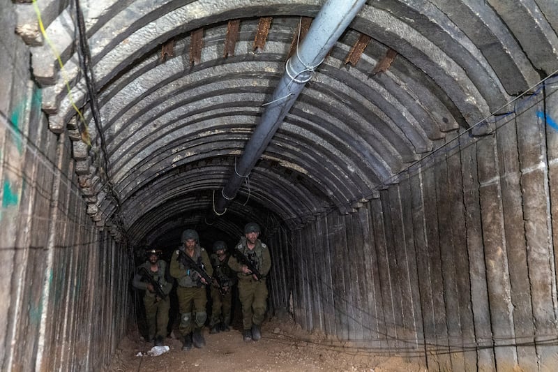Israeli soldiers walk through a Hamas tunnel close to Erez crossing in the northern Gaza Strip. Reuters