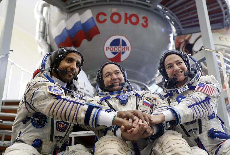 The September 25 mission crew, Hazza Al Mansouri, with cosmonaut Oleg Skripochka and astronaut Jessica Meir, during their final exams in Star City.