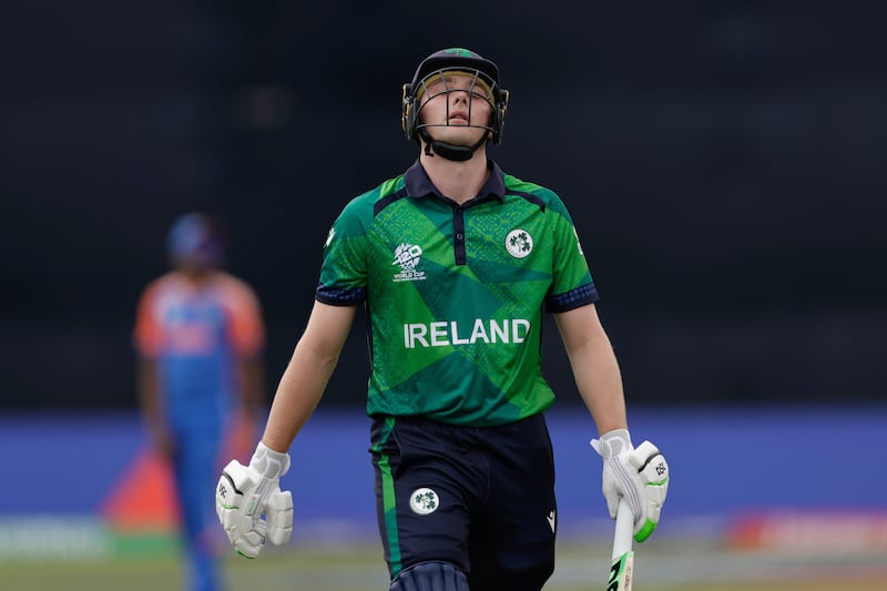 Ireland's Lorcan Tucker walks off the pitch after being bowled out for 10 runs by India's Hardik Pandya. AP 