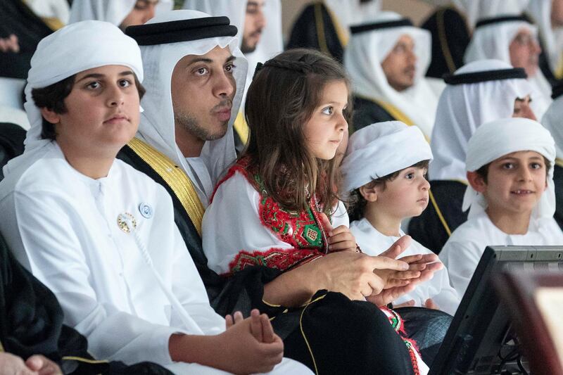 ABU DHABI, UNITED ARAB EMIRATES - December 2, 2018: HH Sheikh Mansour bin Zayed Al Nahyan, UAE Deputy Prime Minister and Minister of Presidential Affairs (2nd L), attends the official 47th UAE National Day Celebration ‘This is Zayed. This is the UAE’ at Zayed Stadium with his children, HH Sheikh Mohamed bin Mansour bin Zayed Al Nahyan (L), HH Sheikha Latifa bint Mansour bin Zayed Al Nahyan (3rd L) HH Sheikh Hamdan bin Mansour bin Zayed Al Nahyan (2nd R) and HH Sheikh Rashid bin Mansour bin Zayed Al Nahyan (R).  
( Ryan Carter / Ministry of Presidential Affairs )
---