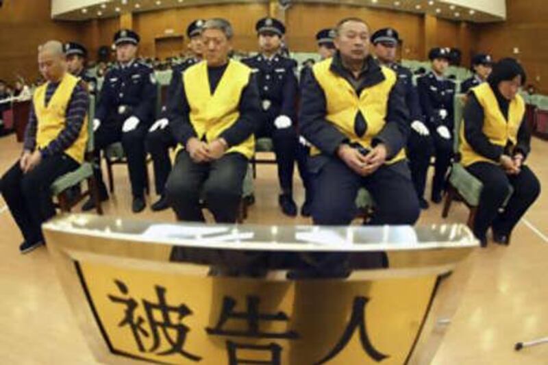 Suspects in the tainted milk case, from left, Gao Junjie, Xue Jianzhong, Zhang Yanjun and Xiao Yu stand trial on Dec 29 2008.
