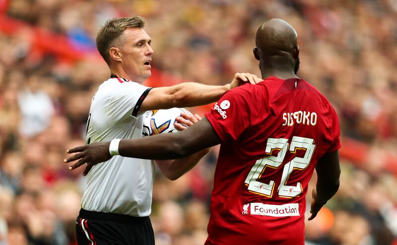 Tempers flare between Manchester United's Darren Fletcher (left) and Liverpool's Mohamed Sissoko during the Legends match at Anfield, Liverpool on September 24, 2022. PA