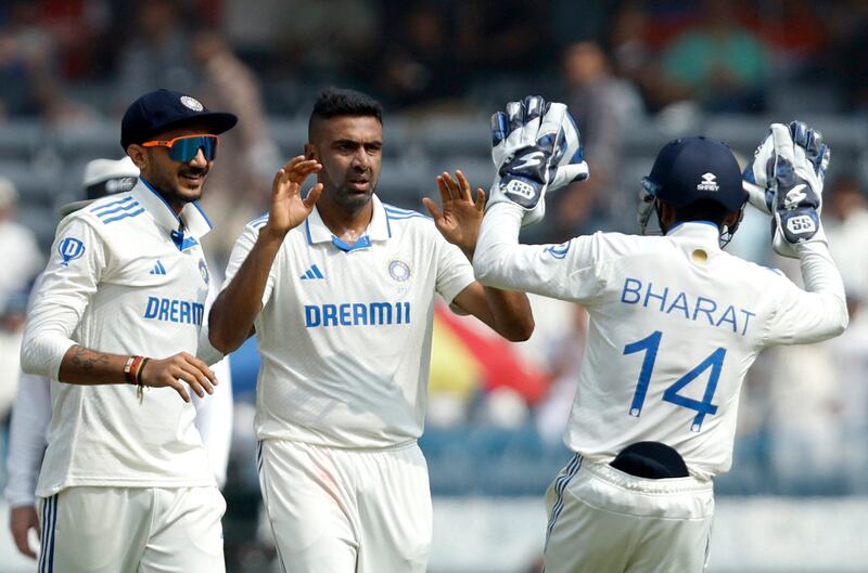 India spinner Ravichandran Ashwin celebrates with teammates after taking the wicket of England's Zak Crawley. Reuters