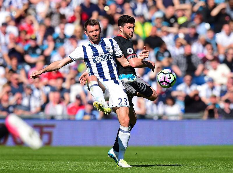 Gareth McAuley of West Bromwich Albion and Shane Long of Southampton battle for possession. Southampton won 1-0 in West Bromwich, England, on Saturday. Tony Marshall / Getty Images