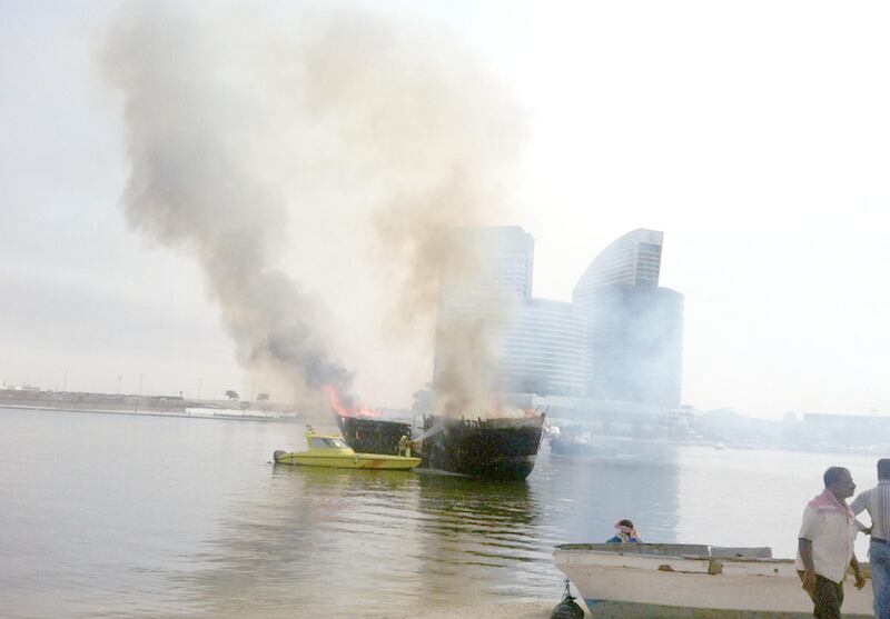 Two boats on fire in Jedaf on Dubai Creek this morning at about 9am. One of the vessels is believed to be a cargo launch. Two explosions were heard by passers-by and thick plumes of smoke could be seen from the Business Bay Crossing nearby. Civil Defence said fire crews were trying to extinguish the flames. (The National- Preeti Kannan)


