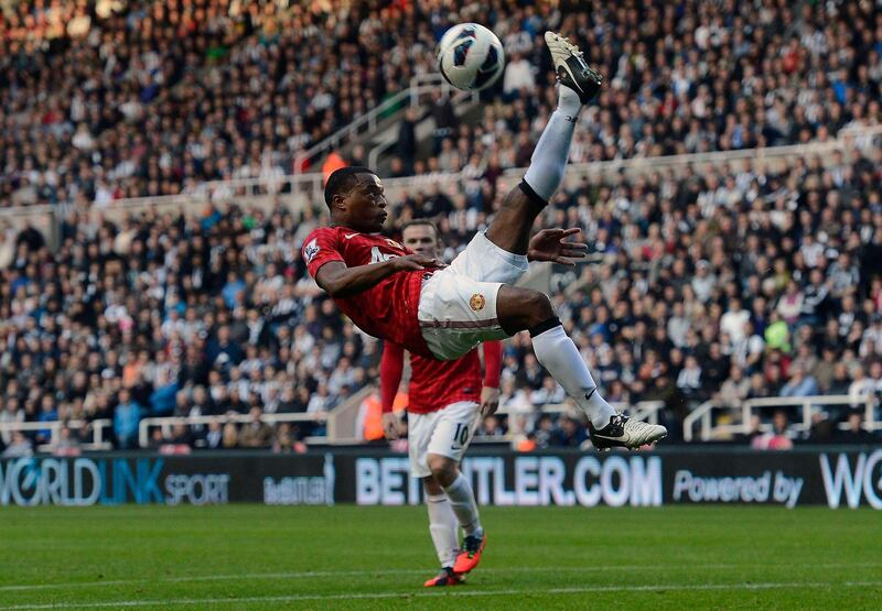 Manchester United's Patrice Evra clears the ball during their English Premier League soccer match against Newcastle United in Newcastle, northern England, October 7, 2012. REUTERS/Nigel Roddis (BRITAIN - Tags: SPORT SOCCER) FOR EDITORIAL USE ONLY. NOT FOR SALE FOR MARKETING OR ADVERTISING CAMPAIGNS. THIS IMAGE HAS BEEN SUPPLIED BY A THIRD PARTY. IT IS DISTRIBUTED, EXACTLY AS RECEIVED BY REUTERS, AS A SERVICE TO CLIENTS *** Local Caption ***  NVR16_SOCCER-ENGLAN_1007_11.JPG