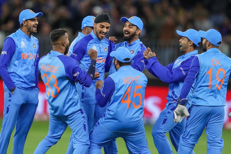 India's Arshdeep Singh, centre, is congratulated by his teammates after the dismissal of South Africa's Rilee Rossouw. AP 